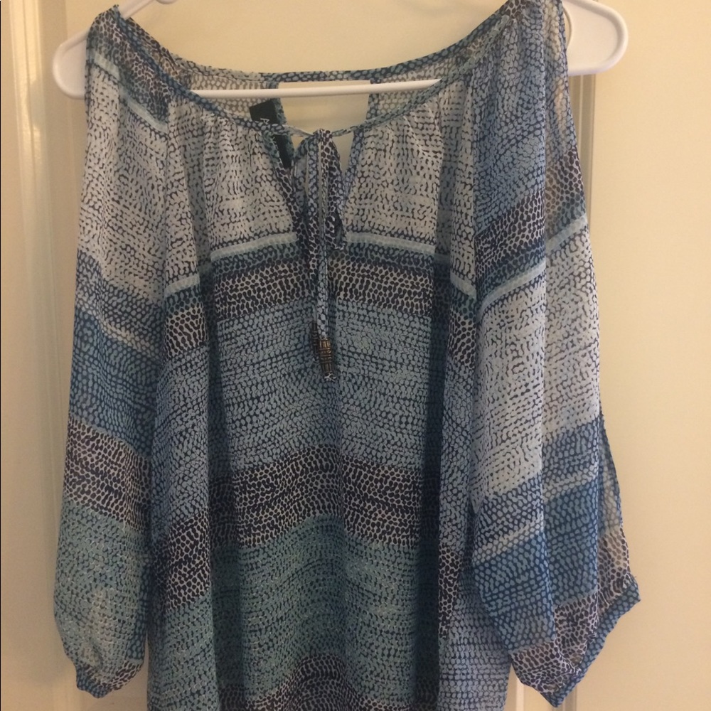 A. Byer sheer top and open sleeves